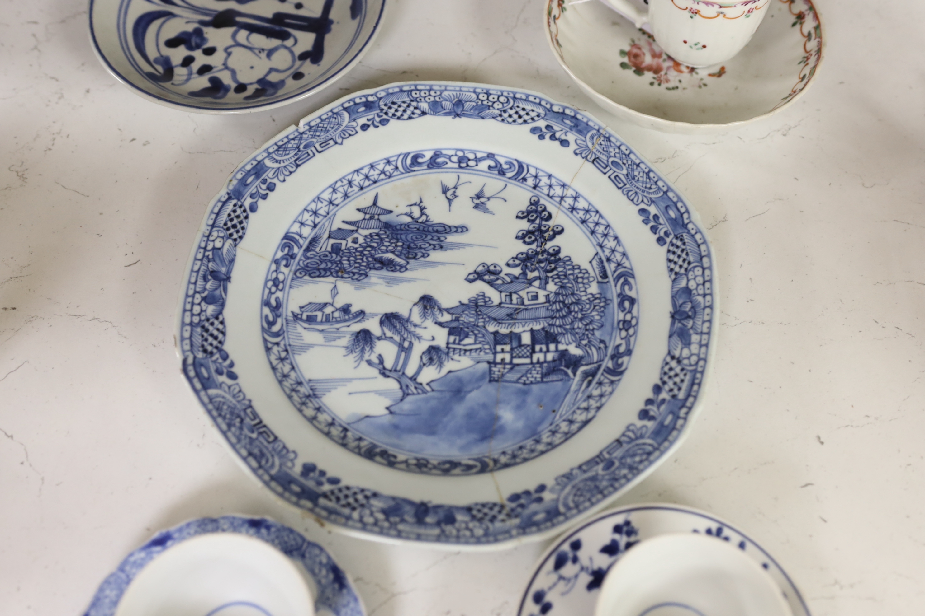 An 18th century Chinese export famille rose teacup and saucer, a similar blue and white octagonal dish, two teabowls and saucers and a plate, largest 23cm